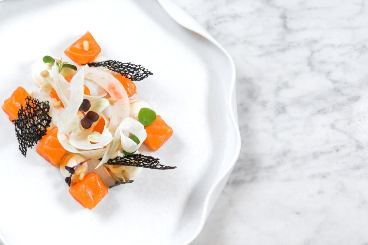 Maritim Hotel Plaza Tiranë Luaran gambar A salad prepared with the edible flowers of the Japanese anemone